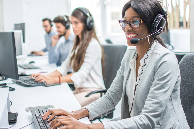 Agents talking to customers on headsets