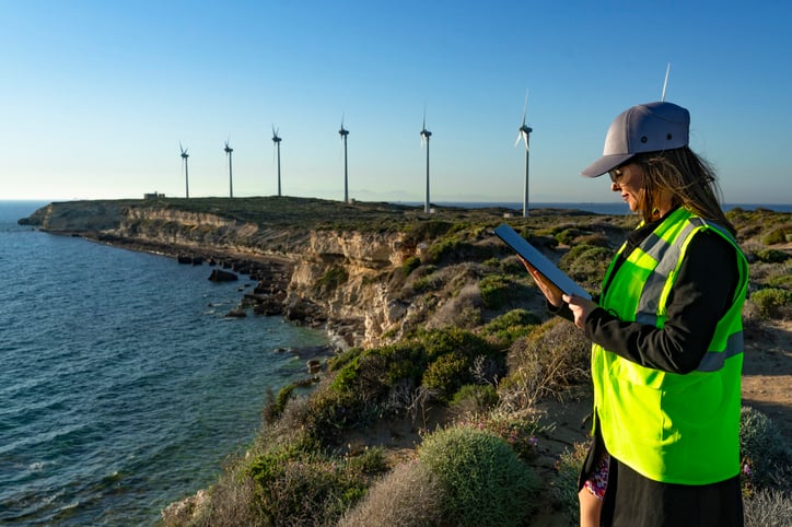 Engineer observing windmill energy